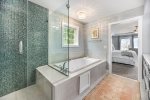 Indulge in a Stream with the Master En Suite`s Walk-in Shower and Relaxing Jacuzzi Tub